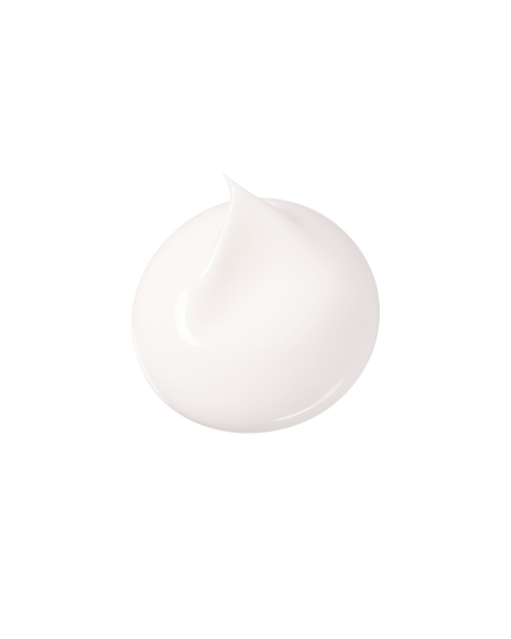 Photo of a rich, velvety cream texture in white with a soft whipped peak.
